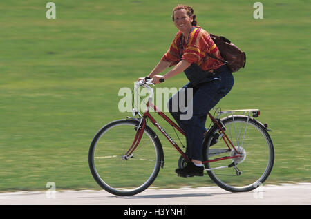 Woman, pregnant, riding of a bike, side view, model released, gestation, Gestation, pregnant, gestation, locomotion, bicycle, sportily, fitness, fit, actively, activity, health, sport, Sportily, cyclist Stock Photo