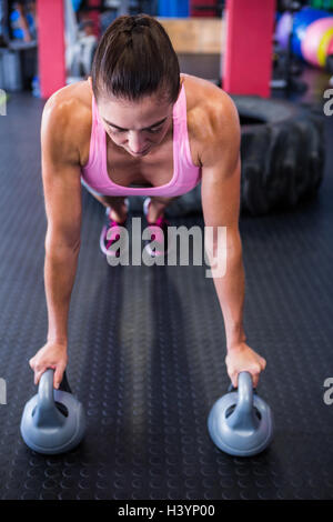 Female athlete doing push-ups Stock Photo