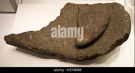 Saddle quern with rubbing stone used for grinding corn. From Wales. Dated 6th Century BC Stock Photo