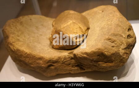 Saddle quern with rubbing stone used for grinding grain. From Wales. Dated 6th Century BC Stock Photo