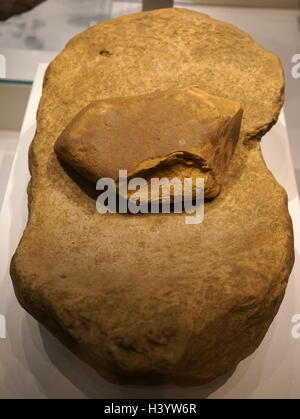 Saddle quern with rubbing stone used for grinding grain. From Wales. Dated 6th Century BC Stock Photo