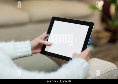 Hands of woman using digital tablet Stock Photo