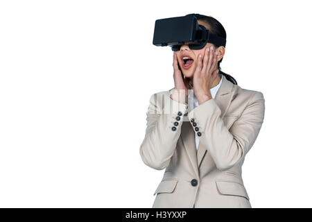 Businesswoman using virtual reality headset Stock Photo