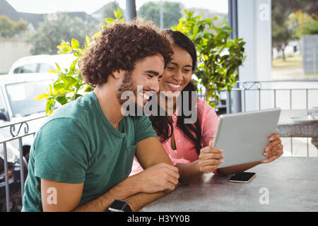 Couple looking at digital tablet Stock Photo