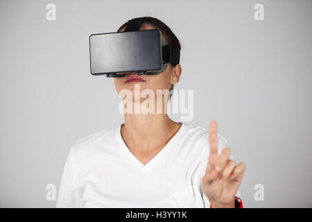 Woman using virtual reality headset Stock Photo