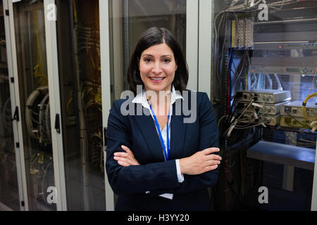 Technician standing in server room Stock Photo