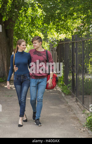 Loving couple walking in casual clothes Stock Photo - Alamy