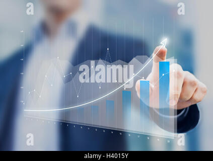 Financial charts showing growing revenue on touch screen Stock Photo