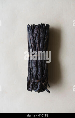 Bunch of vanilla pods on table Stock Photo