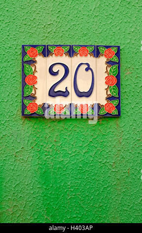 number 20 on green house wall Stock Photo