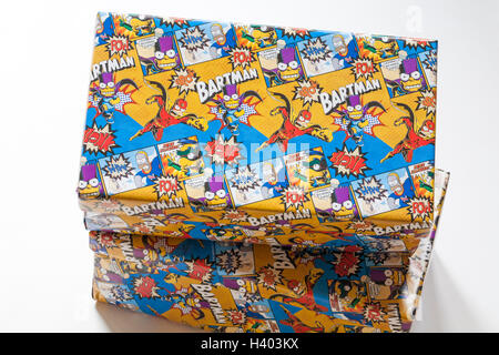 Christmas shoeboxes wrapped in Bartman wrapping paper for charity for children not so privileged Stock Photo
