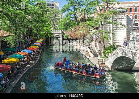 Tourist boat on San Antonio River along the Riverwalk, San Antonio, Texas USA Stock Photo