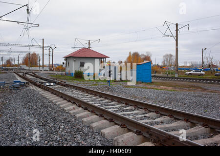 Railway in fog on station, outdoor landscape Stock Photo