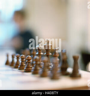 Chess springboard, detail, figures, black, parlour game, board game, game, chess, chess, game figures, chess pieces, strategy, strategy game, tactics, line-up, beginning position, mental exercise, leisure activity, activity, leisure time, hobby, Still lif Stock Photo