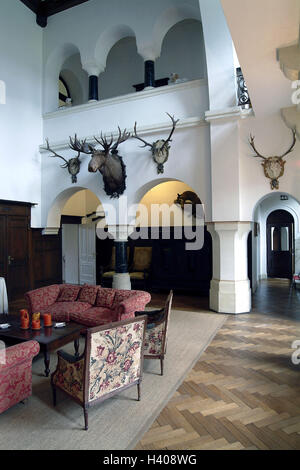 Germany, Saarland, Mettlach, guest house lock Saar corner, foyer, Europe, company Villeroy & Boch, house, building, villa, entrance hall, seat group, trophies, hunting trophies, animal preparations, preserves, elk's head, deer antlers, antlers, wall decoration, decoration, setup, residential decoration, living, nobly, elegantly, luxury, luxuriously, only editorially Stock Photo