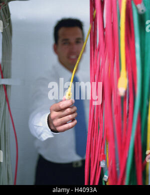 Computer room, server, businessman, controls, cables, point, detail, 20-30 years, business, office worker, manager, man, work, occupation, data processing, computer, server, server room, security, protection, hacker's protection, data rope, data, business data, checking, information system, information scientist, backup, inside, 30-40 years Stock Photo
