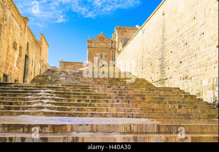 The long staircase is leading to the monumental door that is the symbol of Mardin, Turkey. Stock Photo