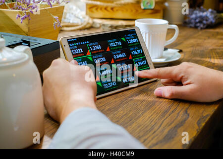 Business man works with foreign exchange rates Stock Photo