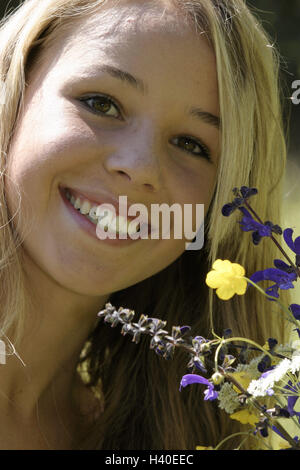 Flower meadow, teenager's girl, happy, portrait, meadow flowers, spring, leisure time, young persons, girls, teenagers, 15 years, blond, long-haired, colour eyes brown, naturalness, beauty, attraction, smile, course, happy, cheerfully, transmission, posit Stock Photo