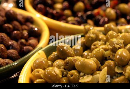 Green and black Olives in bowl Stock Photo