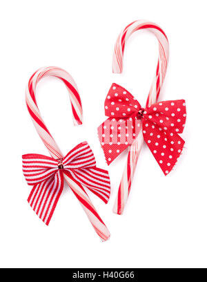 Candy cane with bow. Isolated on white background Stock Photo