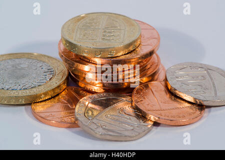 Close-up detail of money - current UK sterling coins in various denominations, both copper and silver - £2, £1, 20p, 2p, 1p. Stock Photo