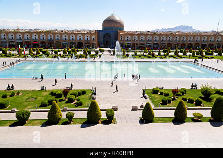 blur in iran   the old square of isfahan prople garden tree heritage tourism and mosque Stock Photo