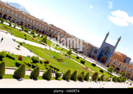 blur in iran   the old square of isfahan prople garden tree heritage tourism and mosque Stock Photo