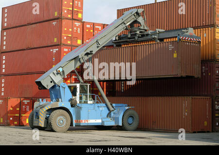 Germany, Hamburg, container port, Buss Hanse terminal, transport vehicle, container, Europe, Hanseatic town, town, seaport, cargo harbour, harbour, trading centre, BHT, multinational pure pose terminal, navigation, vehicle, Reachstacker, container stacker, transport, cargo, charge, loaded, export, import, transport, Cargo, logistics, economy Stock Photo