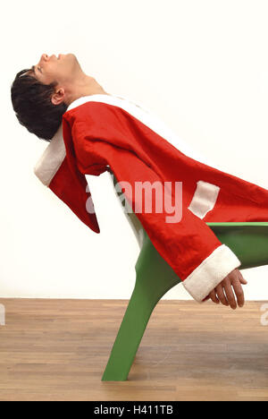 Santa Claus, exhausts, chair, sit, side view, detail, man, person, young, 20-30 years, dark-haired, Christmas, Christmas, yule tide, for Christmas, Christmas, xmas, x-mas, feast, feasts, holidays, Christmas Days, casing, red, costume, dresses up, lining, Stock Photo