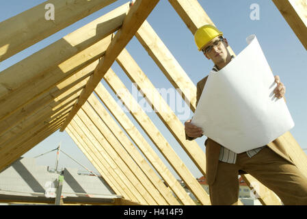 Men at work, roof truss, architect, construction helmet, plan, control construction, building of a house, man, 20-30 years, occupation, work, structural engineer, developer, safety helmet, hard hat, architect's plan, site manager, construction supervision Stock Photo