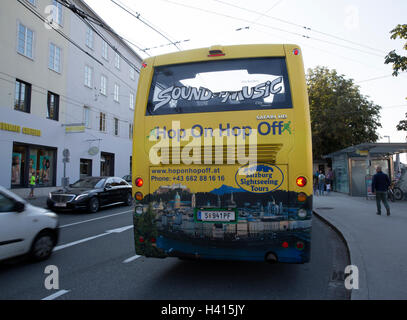 Hop on Hop off Sound of music tour bus In Salzburg Austria Stock Photo
