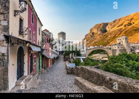 Early morning at Kujundziluk alley, before shops open, Old Bridge in distance, Mostar, Bosnia and Herzegovina Stock Photo