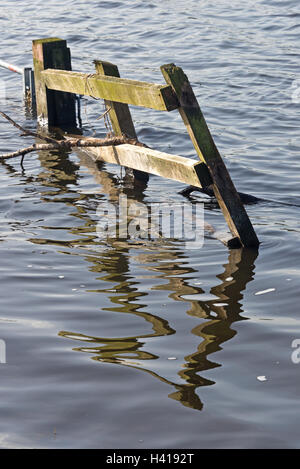 Gates and fences uncovering as flood waters recede across Curry Moor on the Somerset Levels after the floods in 2014 Stock Photo