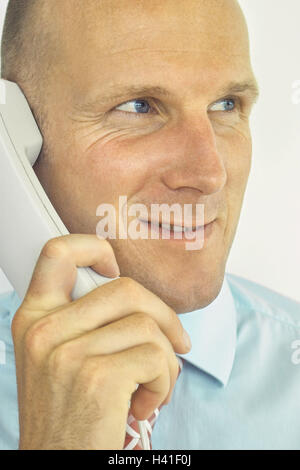 Businessman, call up, thoughtful, portrait, curled, man, 25 listen - 30 years, 30-40 years, shirt, tie, office worker, clerk, phone, telecommunication, communication, telephone call, interest, attention, friendly, smile, balance, satisfaction, business, w Stock Photo