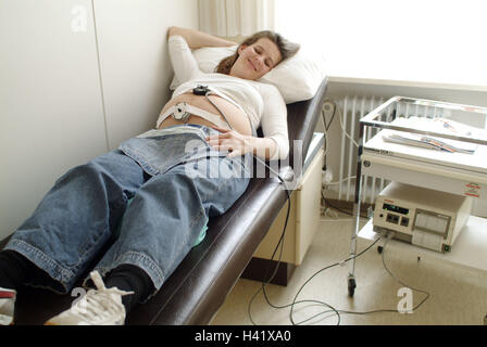 Gynecology, woman, pregnant, CTG examination, medical practise, gynecology, CTG, Kardiotokograph, gestation, pregnant, lie, measure measuring instrument, measuring electrodes, labour pains writers, Kardiotokogramm, measurement, control, controlling examin Stock Photo