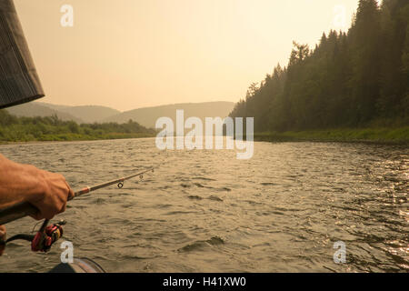 Female Hand Holding A Fishing Pole Against The Background Of The Sea. Sea  Fishing. The Woman Is Fishing. Stock Photo, Picture and Royalty Free Image.  Image 114604111.