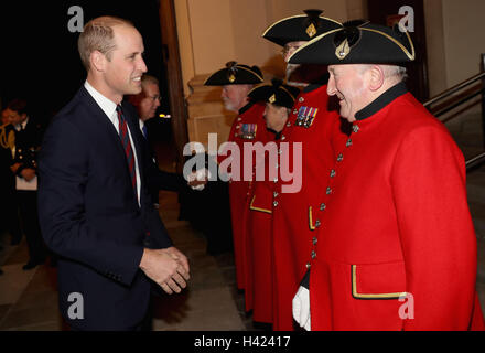 The Duke of Cambridge speaks to Chelsea Pensioner Derek Goodall whilst attending the MOD Employer Recognition Scheme Gold Awards being held at the Royal Hospital Chelsea in London. Stock Photo