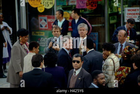 Washington, DC. USA, 18th November, 1992 President Elect William Jefferson Clinton is well guarded by secret service agents (Dave Carpenter lead agent of the presidential detail with the gray hair next to the Clinton)  during a walking tour of one block of Georgia Ave, NW. Washington DC. This area of DC is know as an open air drug market and has had numerous murders in the past years.  Credit: Mark Reinstein Stock Photo