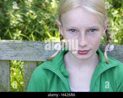 Garden bank, girls, blond, Braids, portrait, broached,   Series, 10-15 years, teenager girls, teenagers, gaze camera, freckles, jacket green, naturalness, sits, waits, however seriously, expectation, sorrowfully, outside, summers, Stock Photo