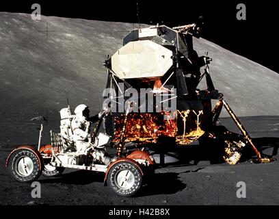 NASA Apollo 17 crew member astronaut Eugene Cernan drives the Lunar Roving Vehicle around the Lunar Module during extravehicular activity on the lunar surface December 11, 1972 at the Taurus-Littrow landing site on the Moon. Stock Photo