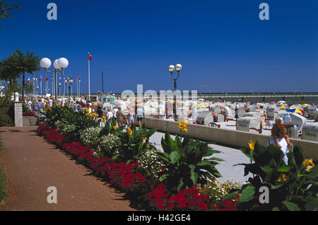 Germany, Schleswig - Holstein, Grömitz, seafront, flowers, passers-by, Europe, North Germany, the Baltic Sea, sea, Baltic bath, Ostholstein, sandy beach, Baltic beach, tourism, tourist, vacationer, vacation, bathers, beach chairs, beach vacation, rest, leisure time, promenade, pedestrian, lanterns, flowerbed, plants, exotic, floral decoration Stock Photo