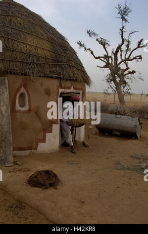 India, Rajasthan, Bikaner, mucky hut, man, Stock Photo