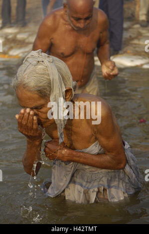 India, Uttar Pradesh, Allahabad, Kumbh Mela, senior, ablution, no model release, Stock Photo