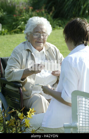 Senior, invalid, wheel chair, old nurse, photos, show old people's home, old people's home, senior citizen's home, garden, park, woman, old, old person, pensioner, pensioner, happy, smile, joy, nurse, pictures, family pictures, consider, look, entertainme Stock Photo