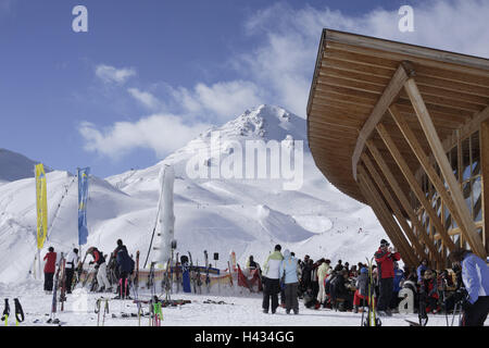 Austria, Tyrol, Serfaus, skiing area, mountain restaurant, Masner, detail, guests, no model release, alps, mountains, season, winter, snow, snow-covered, winter sports area, winter sports, skiing area, tourism, tourism, person, skiing, ski runway, outside, restaurant, ski hut, building, architecture, Masnerkopf, departure, ski lift, skier, wooden construction, Stock Photo