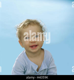 Toddler, girls, semi-portrait, laughs series, people child 9 months, top light-blue, gaze camera, eye-color blue, milk-teeth, edge-teeth, childhood freely, naturalness, cutely, peacefully, interior, Stock Photo