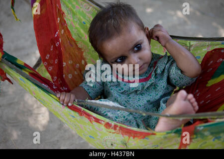 India, Rajasthan, close Luni, tribe Bisnoi, hammock, girl, no model release, Stock Photo