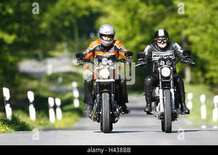 Country road, motorcycles, Harley Davidson, journey, side by side, age difference, front view, Stock Photo