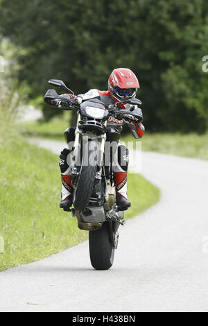 Country road, motorcycle, journey, Wheelie, front view, Stock Photo